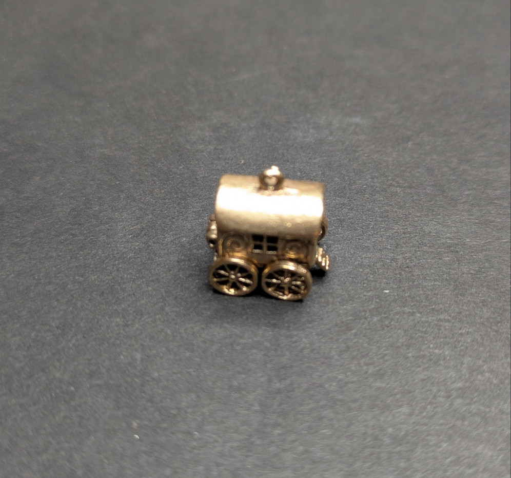 14kt Movable Charm Wagon Which Opens to Women at Table