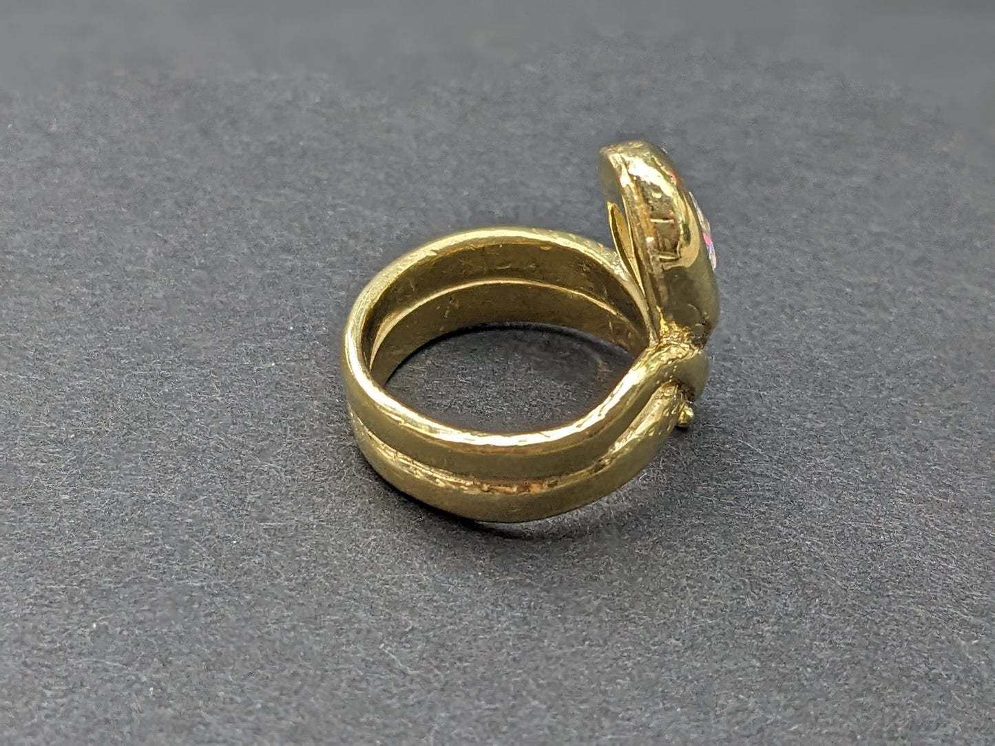 Heavy snake ring with wrapped tail and rose cut diamond center