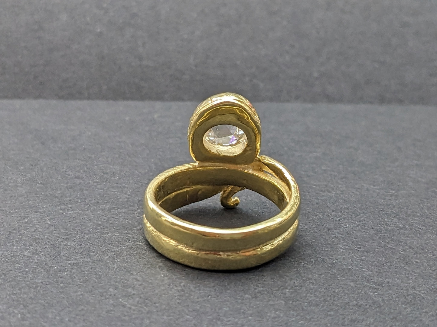 Heavy snake ring with wrapped tail and rose cut diamond center