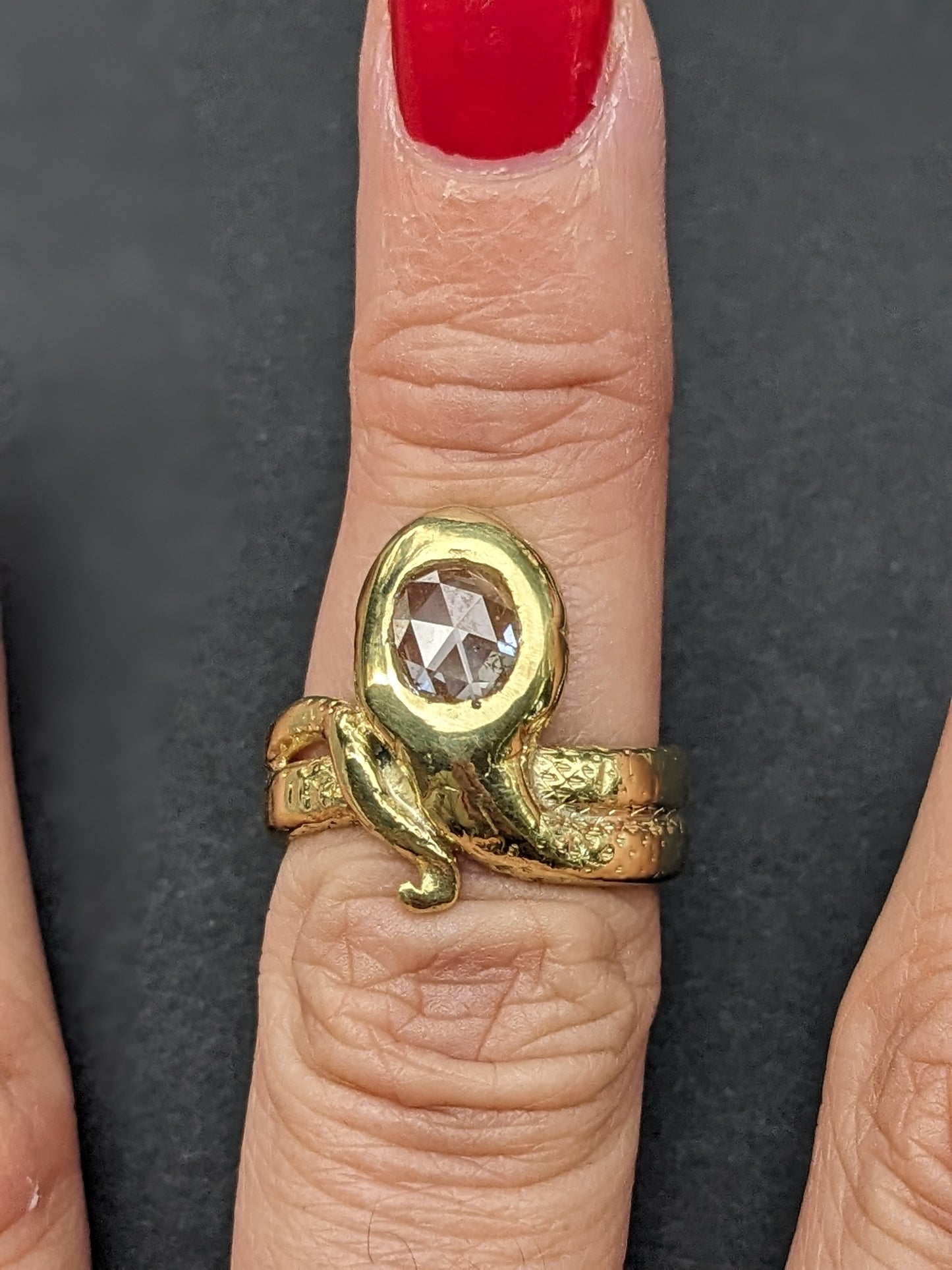 Heavy snake ring with wrapped tail and rose cut diamond center