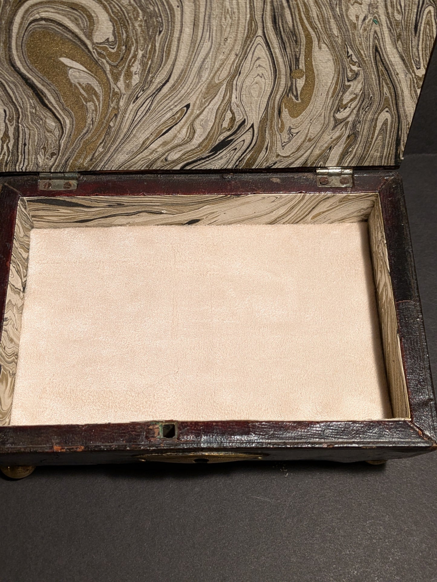 Brown wood jewelry box with gold adornment