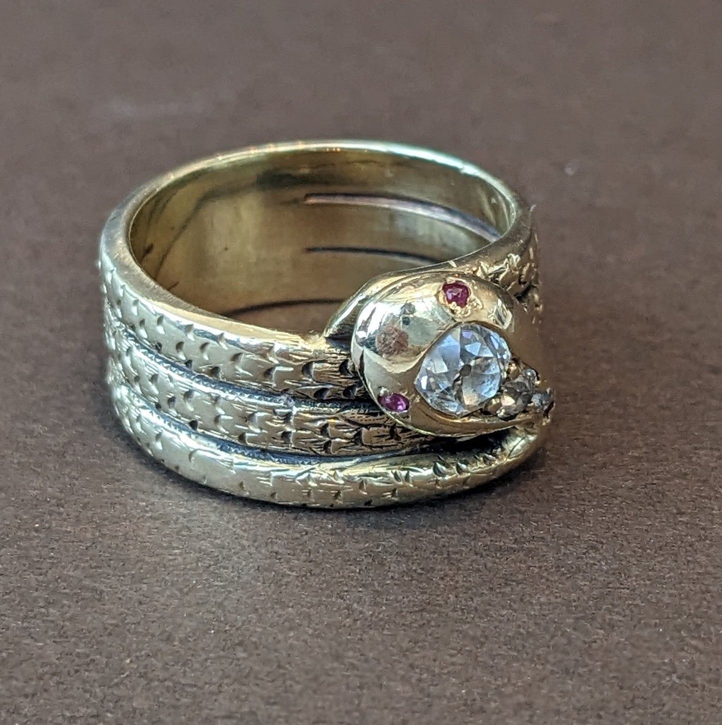 Heavy 18k snake ring with mine cut diamonds head