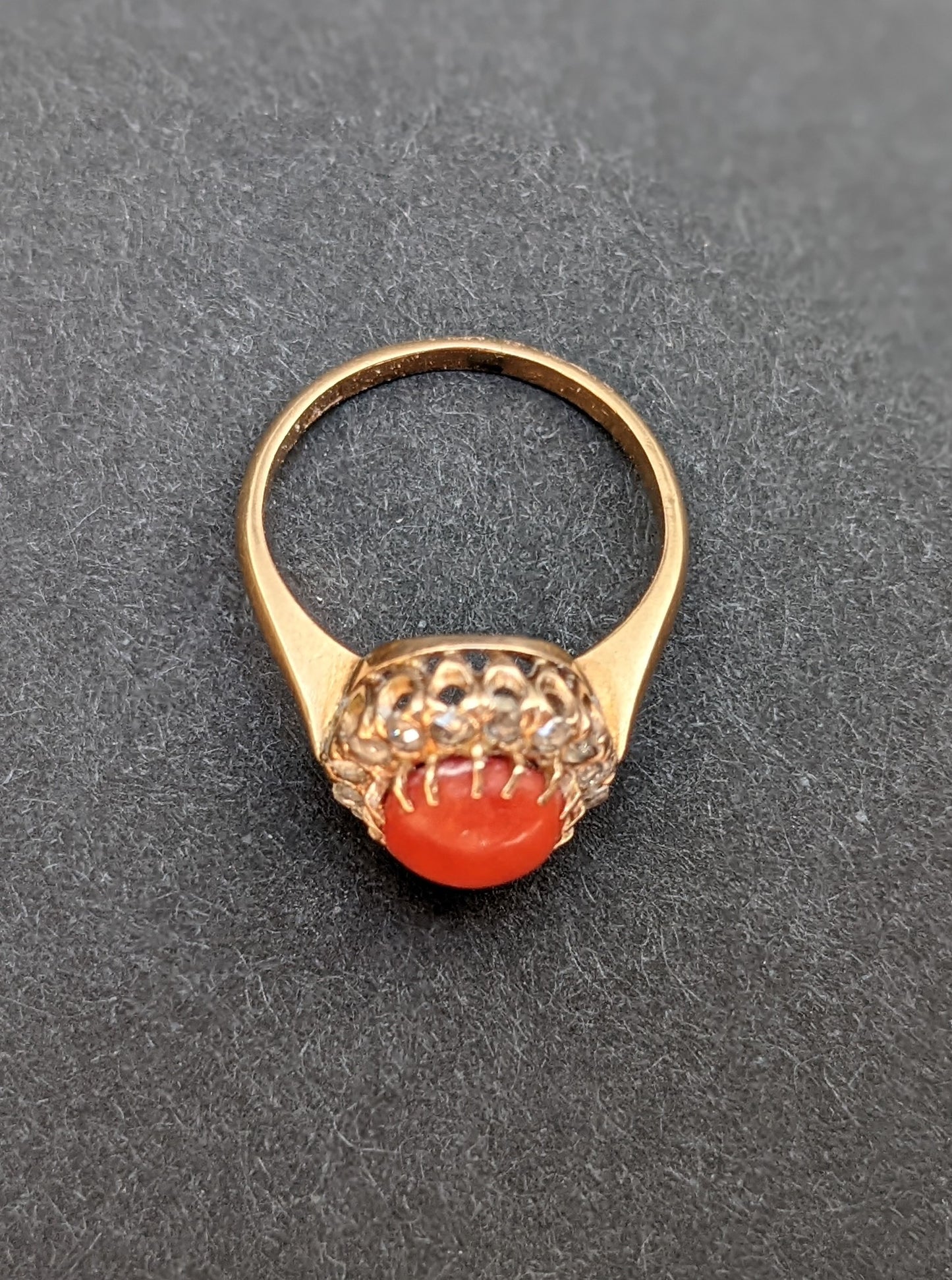 18k Ring with coral and a mine cut diamond halo