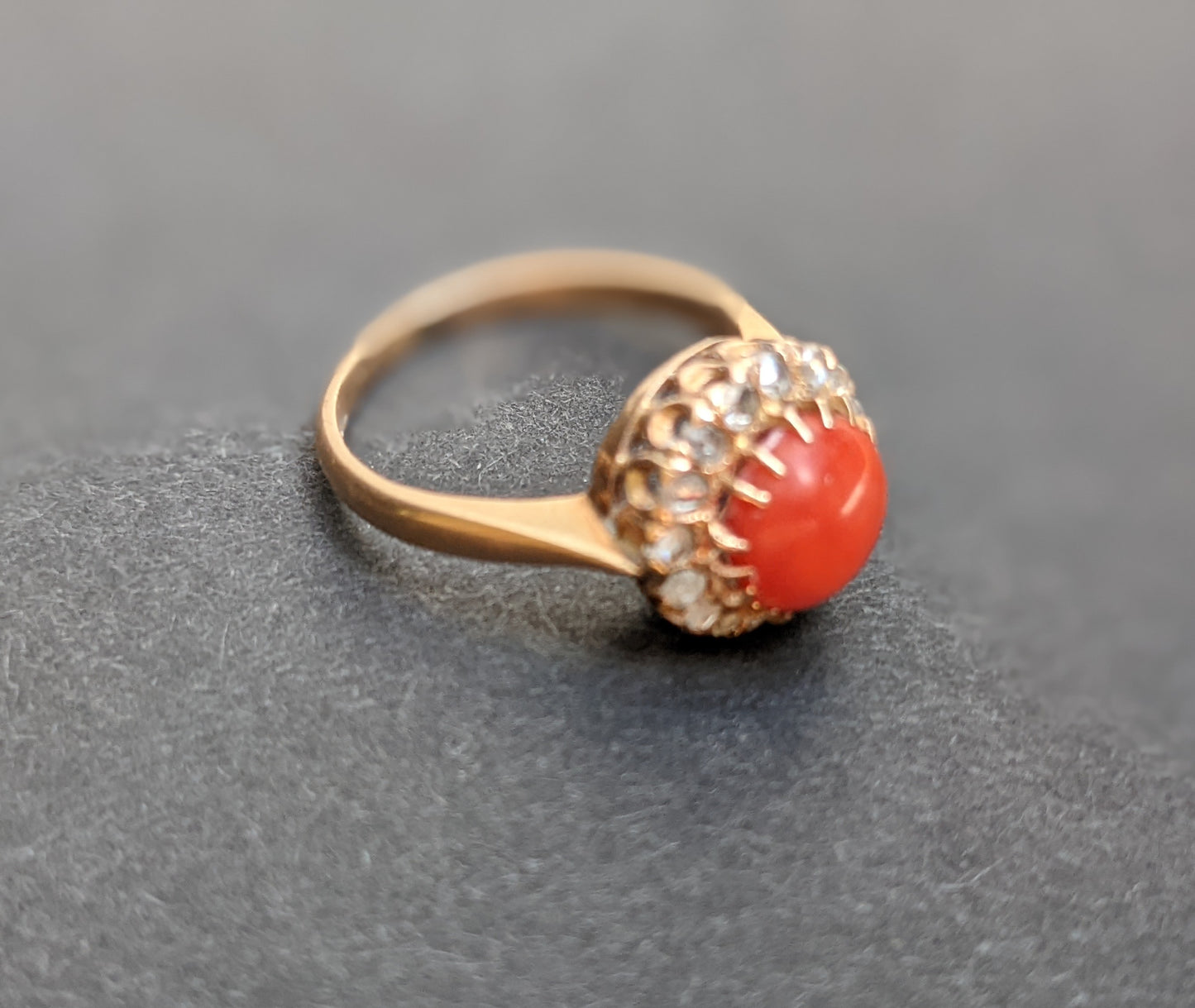 18k Ring with coral and a mine cut diamond halo