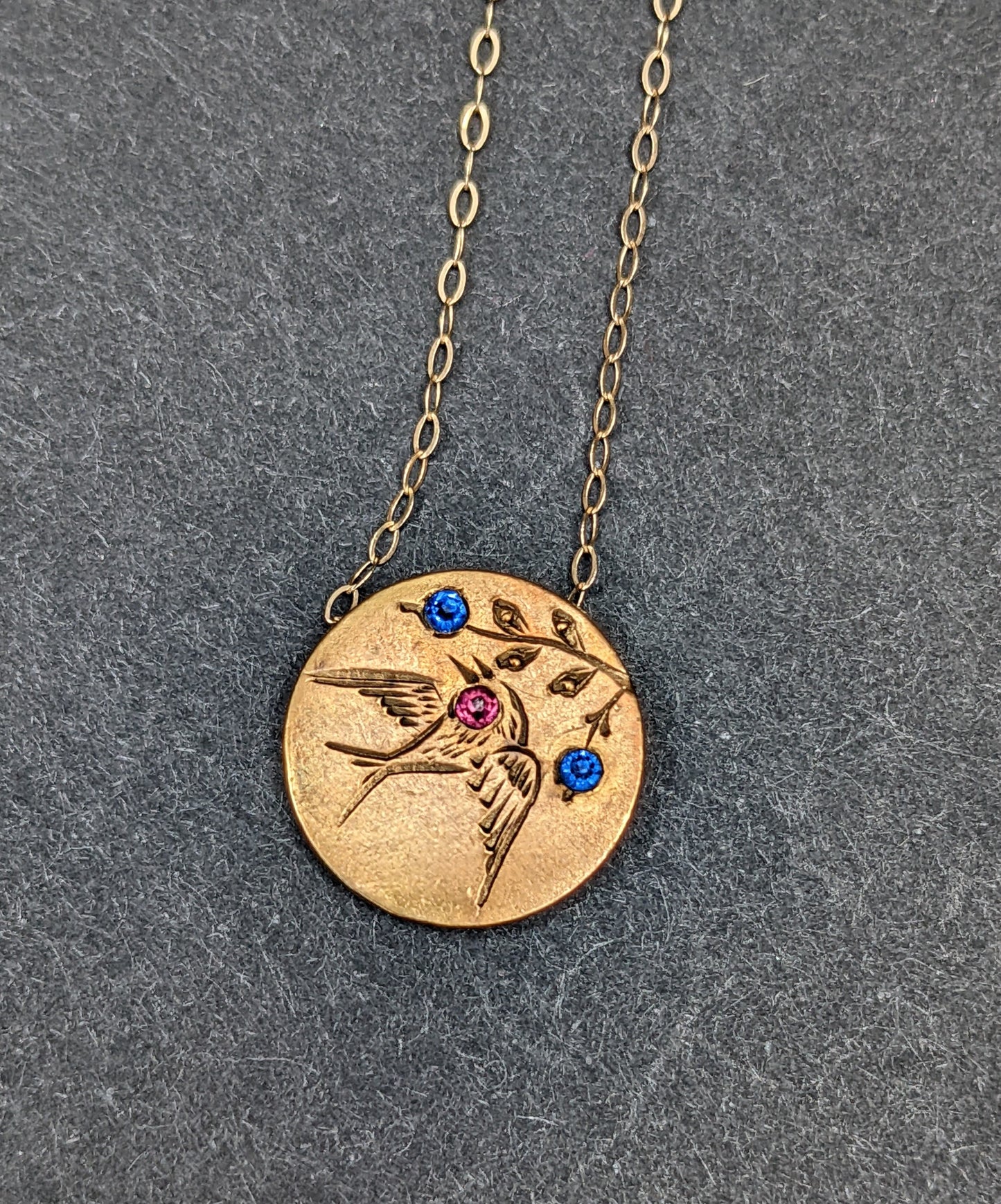 Engraved swallow necklace with sapphires inset