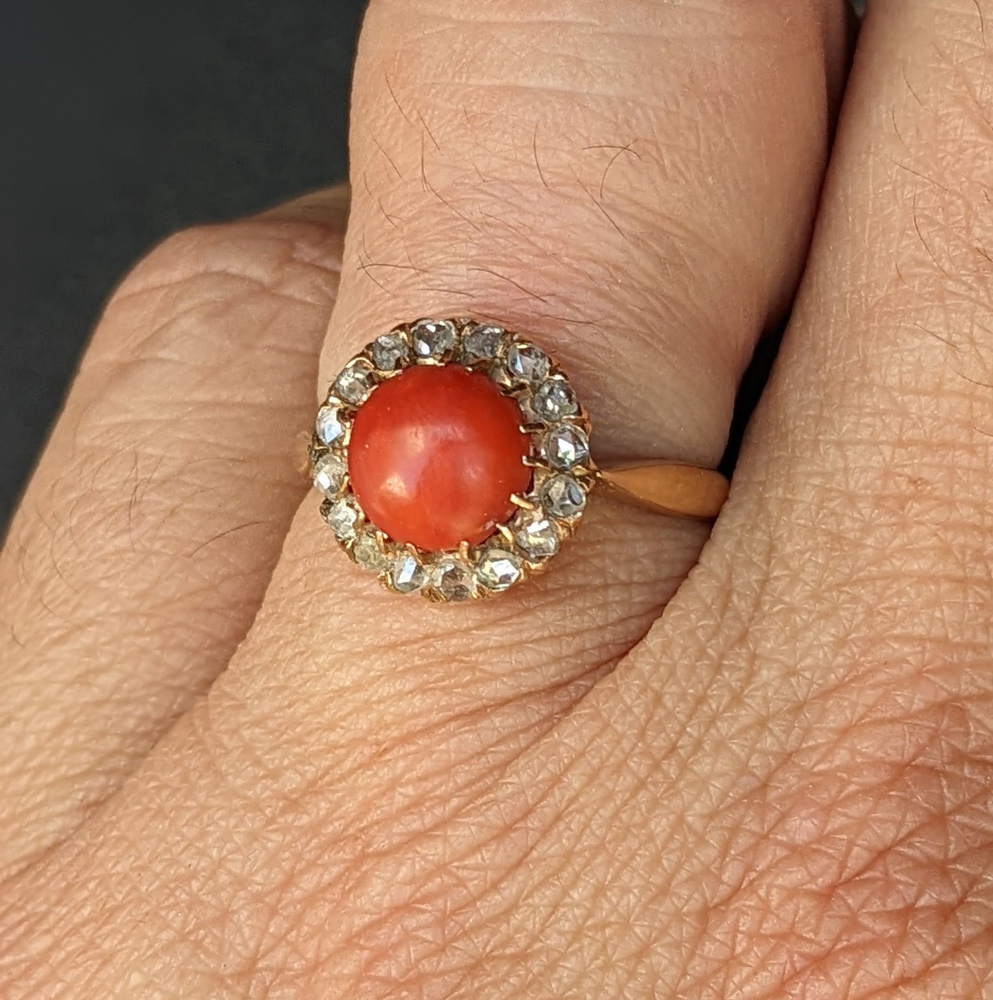 18k Ring with coral and a mine cut diamond halo