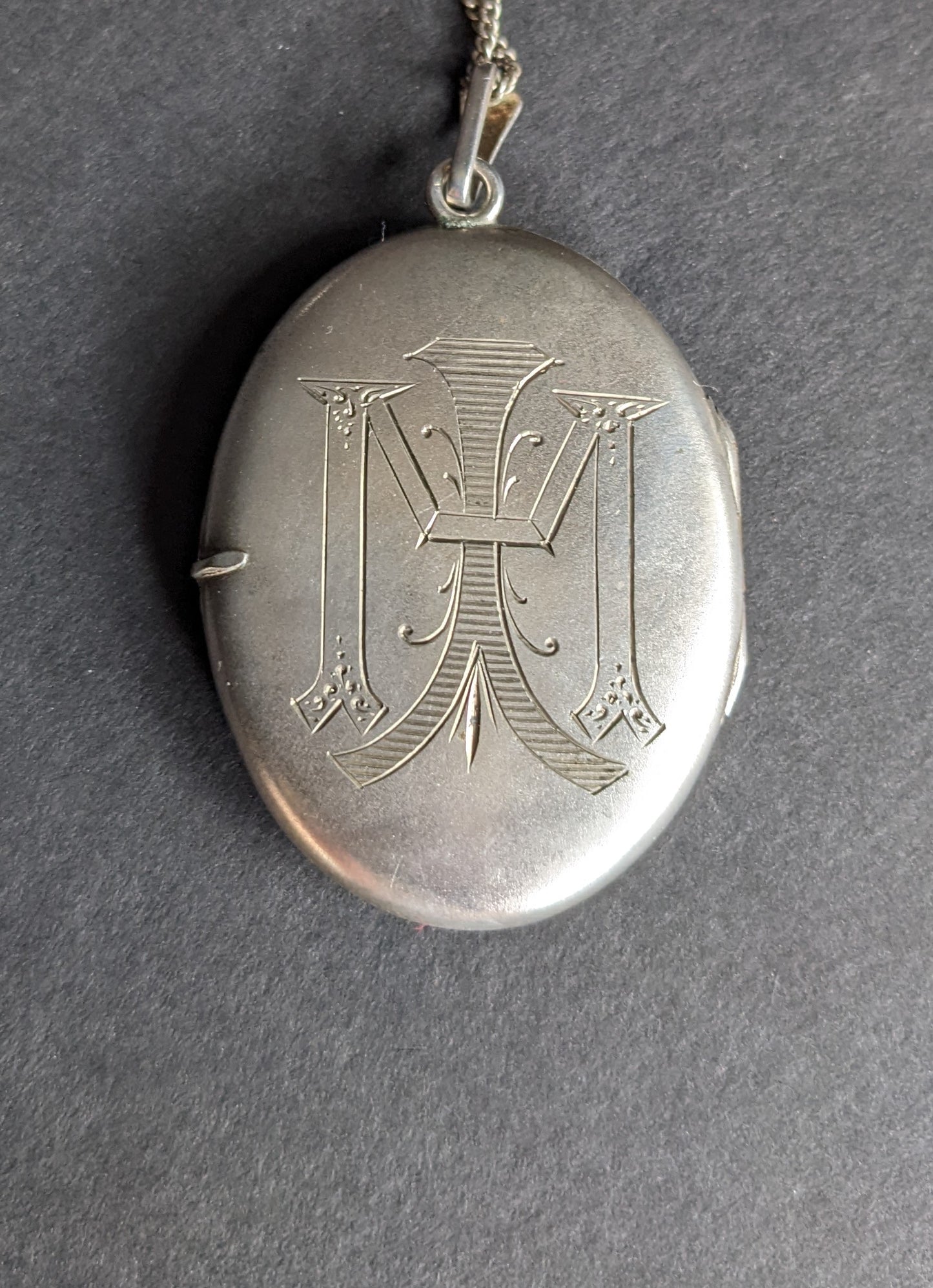 Large silver locket with enamel rose and monogram