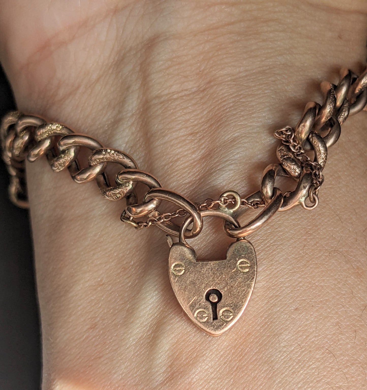 Rose gold curb chain bracelet with heart padlock
