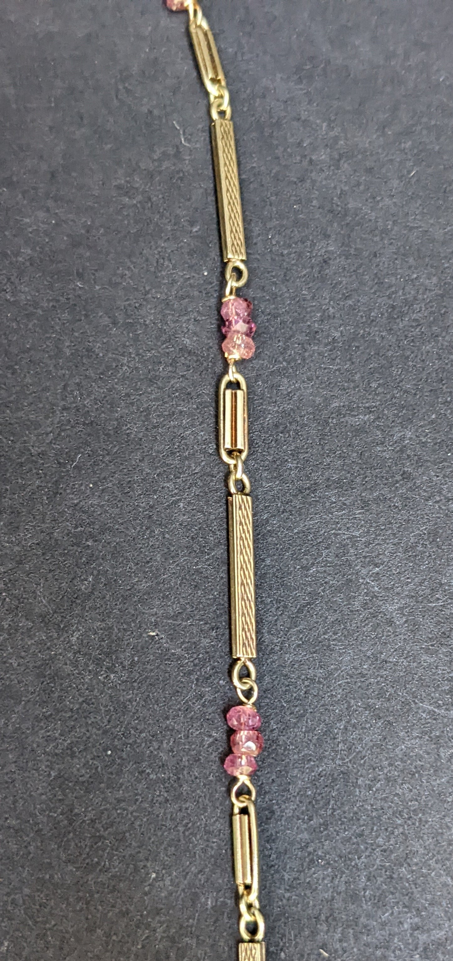 Yellow gold watch chain with pink sapphire additions