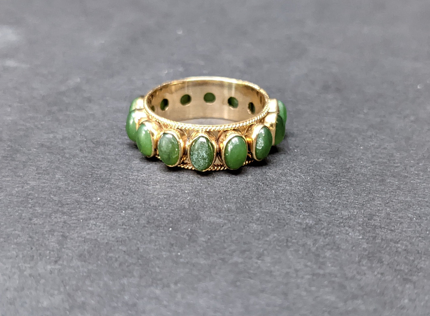 Wide bezel set jade eternity band