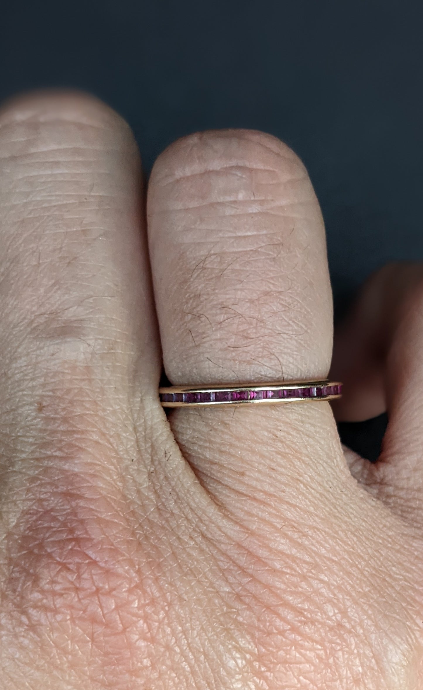 Ruby and yellow gold eternity band