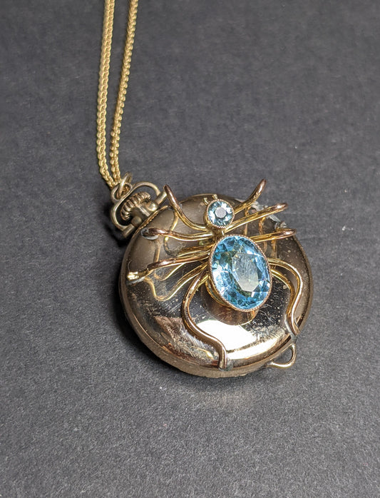 Spider on antique watch with gold chain