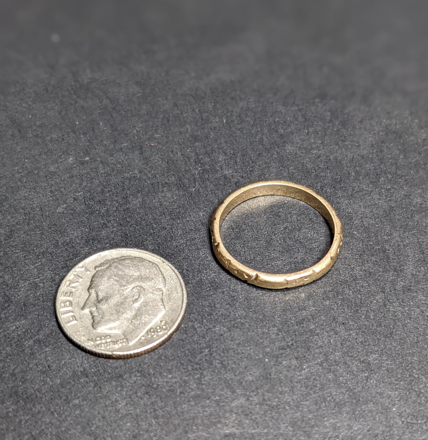 14k yellow gold wedding band with floral engraving