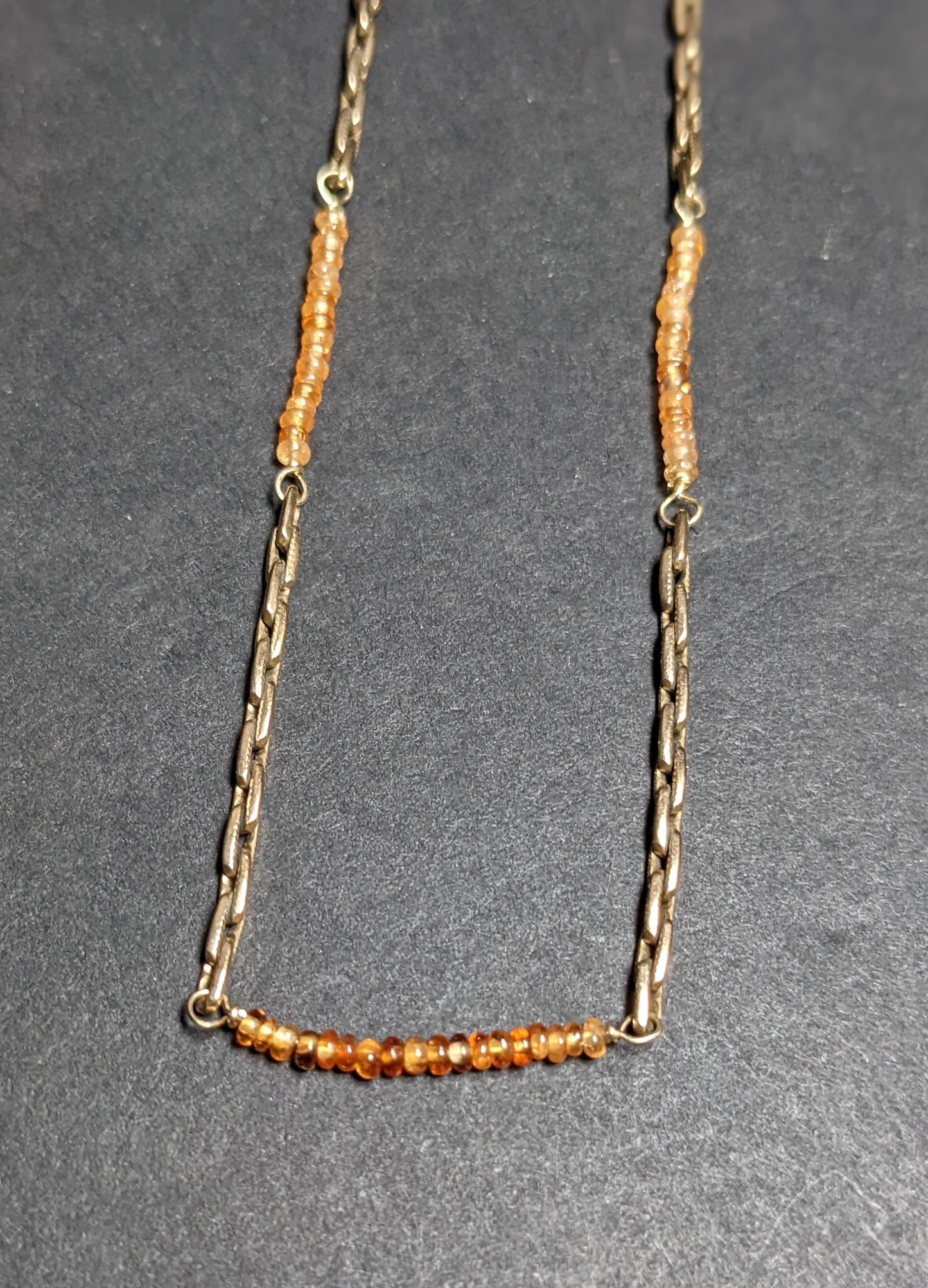 14k Gold watch chain with large bolt clasp and orange sapphire additions