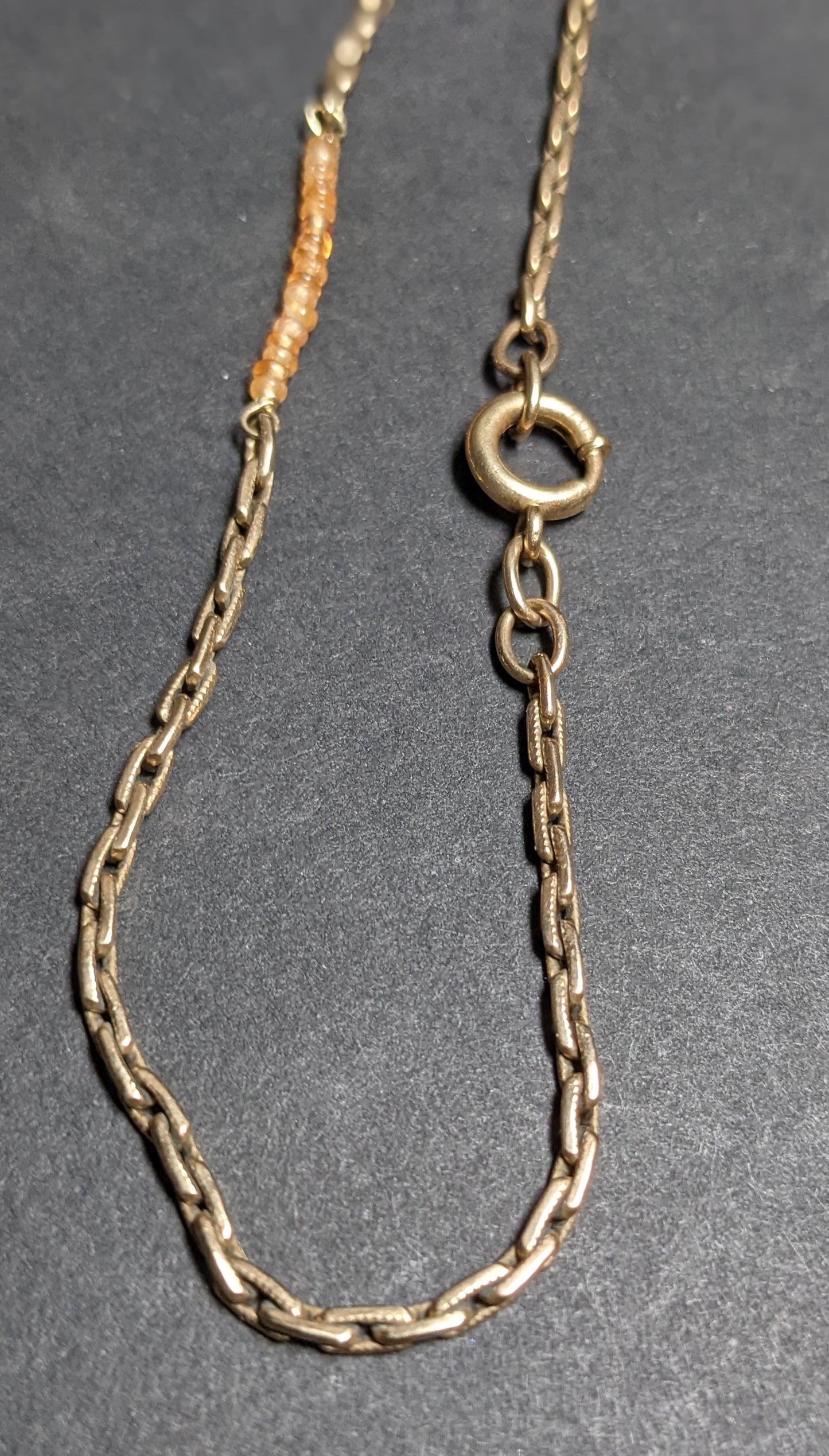14k Gold watch chain with large bolt clasp and orange sapphire additions