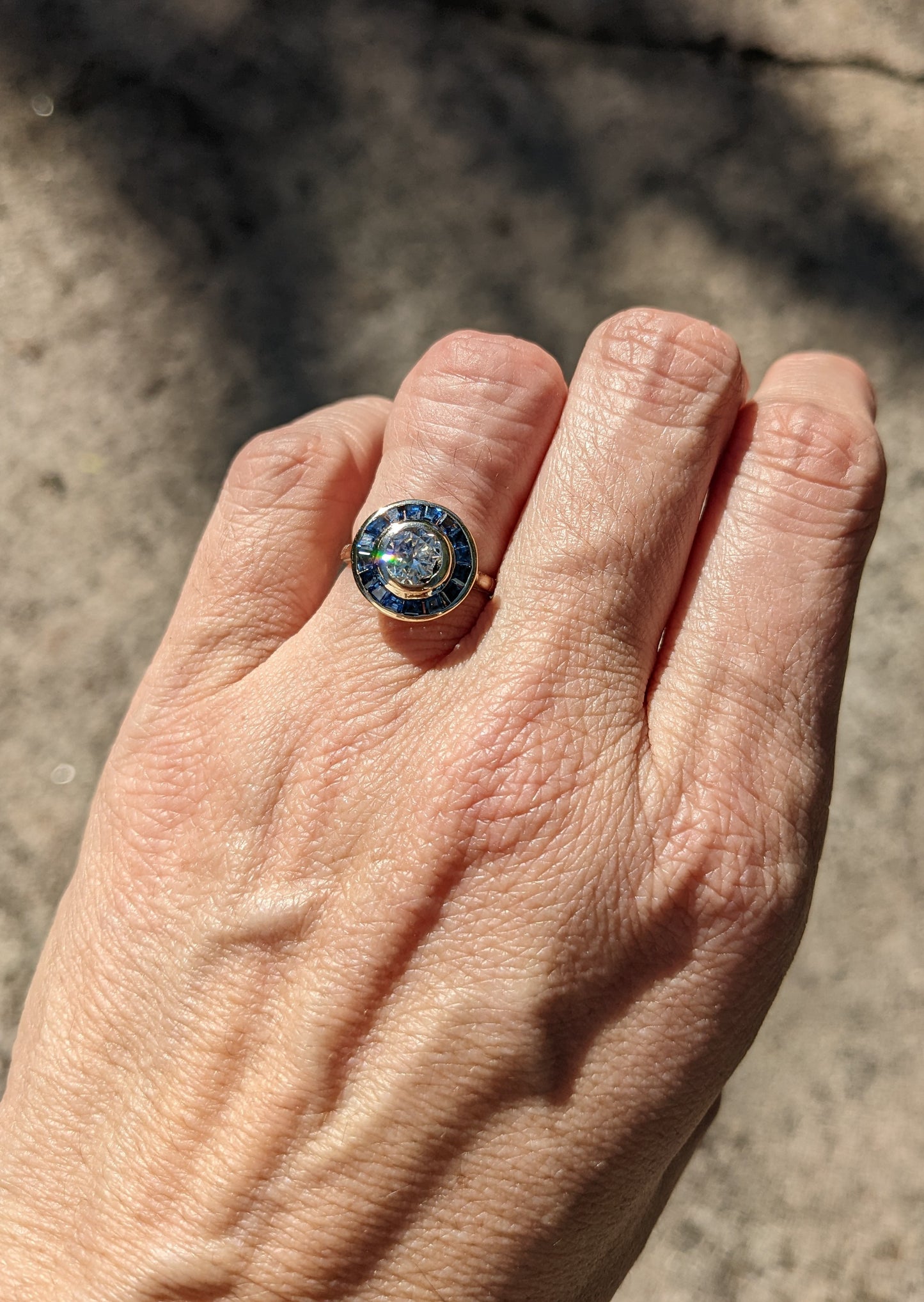 Art deco sapphire halo diamond ring