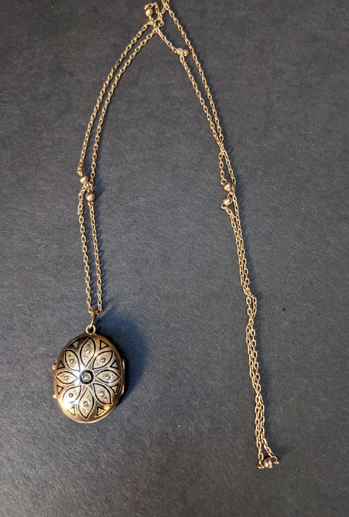 14k German locket with enamel on long beaded chain