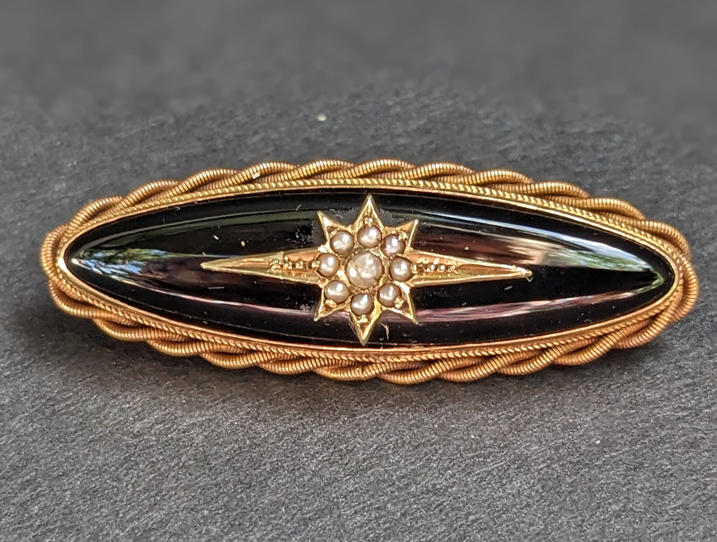 Long Oval 12Kt Onyx Mourning Brooch with Braid and Seed Pearl Starburst