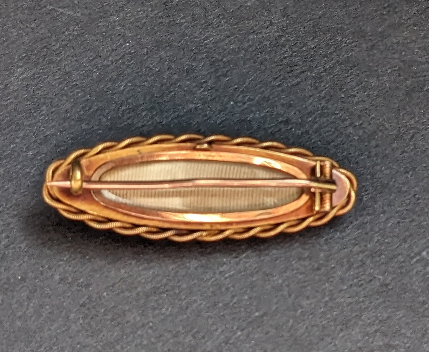 Long Oval 12Kt Onyx Mourning Brooch with Braid and Seed Pearl Starburst