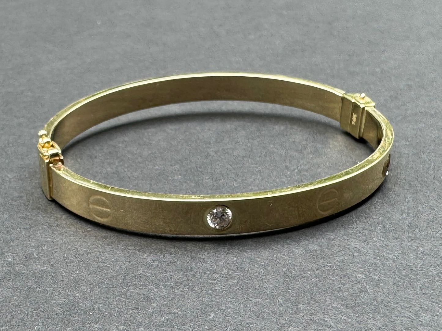 14k Gold and Diamond "Not a Cartier" Bangle Bracelet