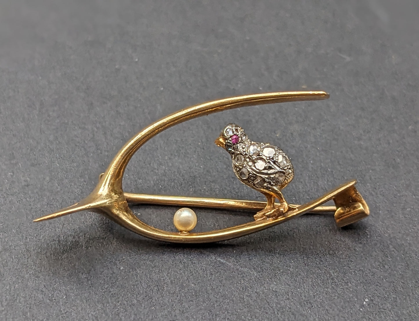 18k French wishbone with silver and diamond chick, pearl egg