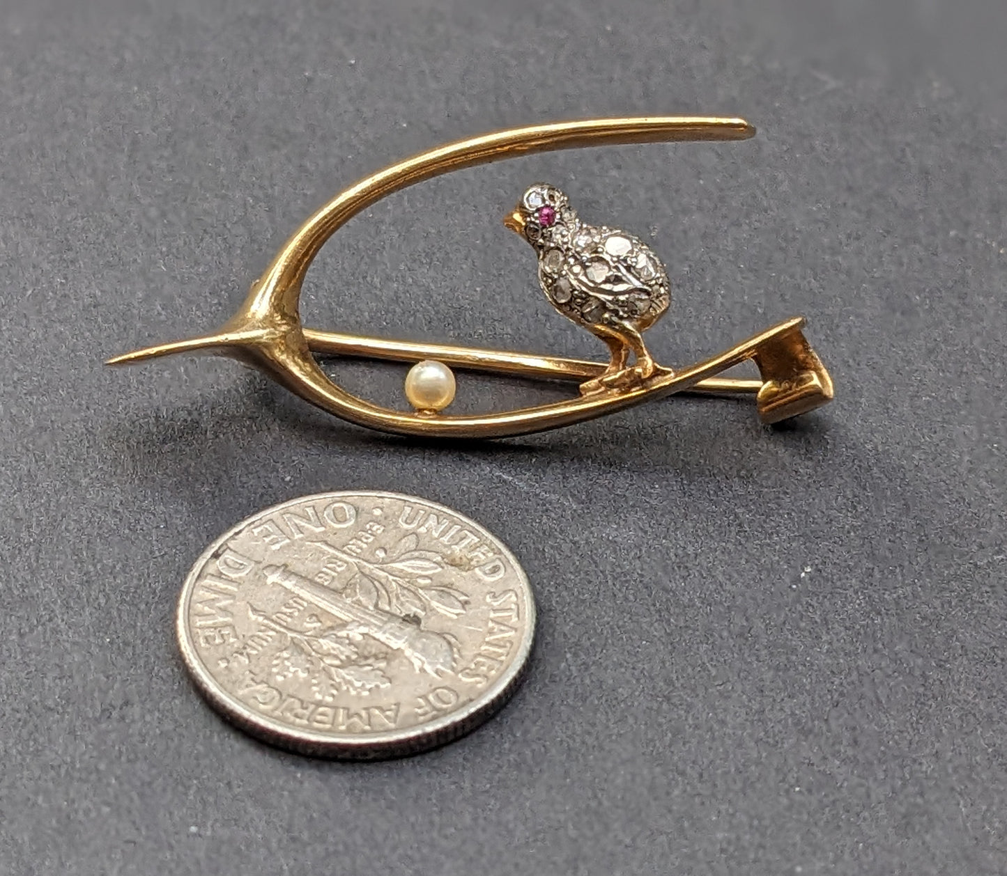 18k French wishbone with silver and diamond chick, pearl egg