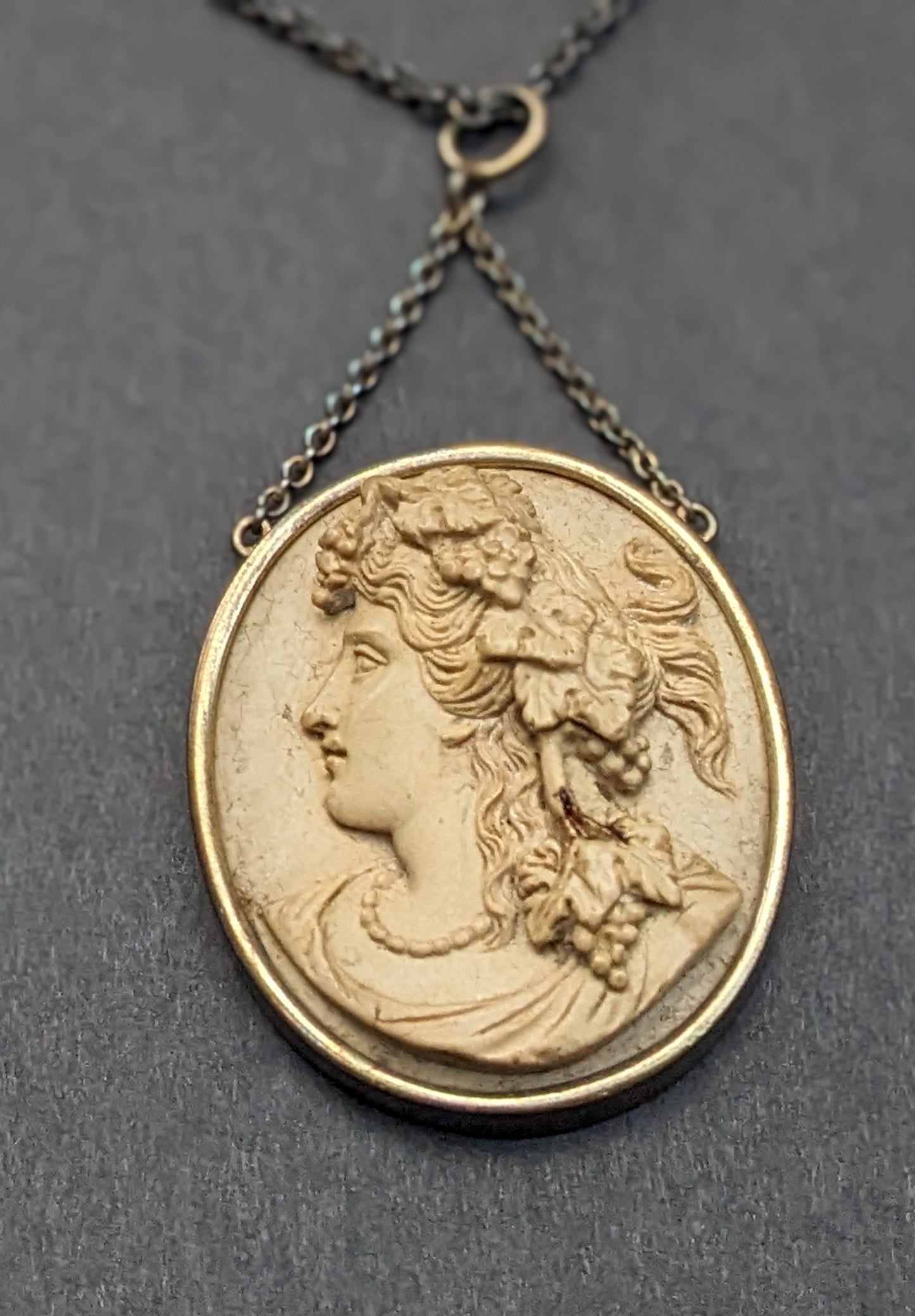 Carved lava cameo necklace. Barrel clasp