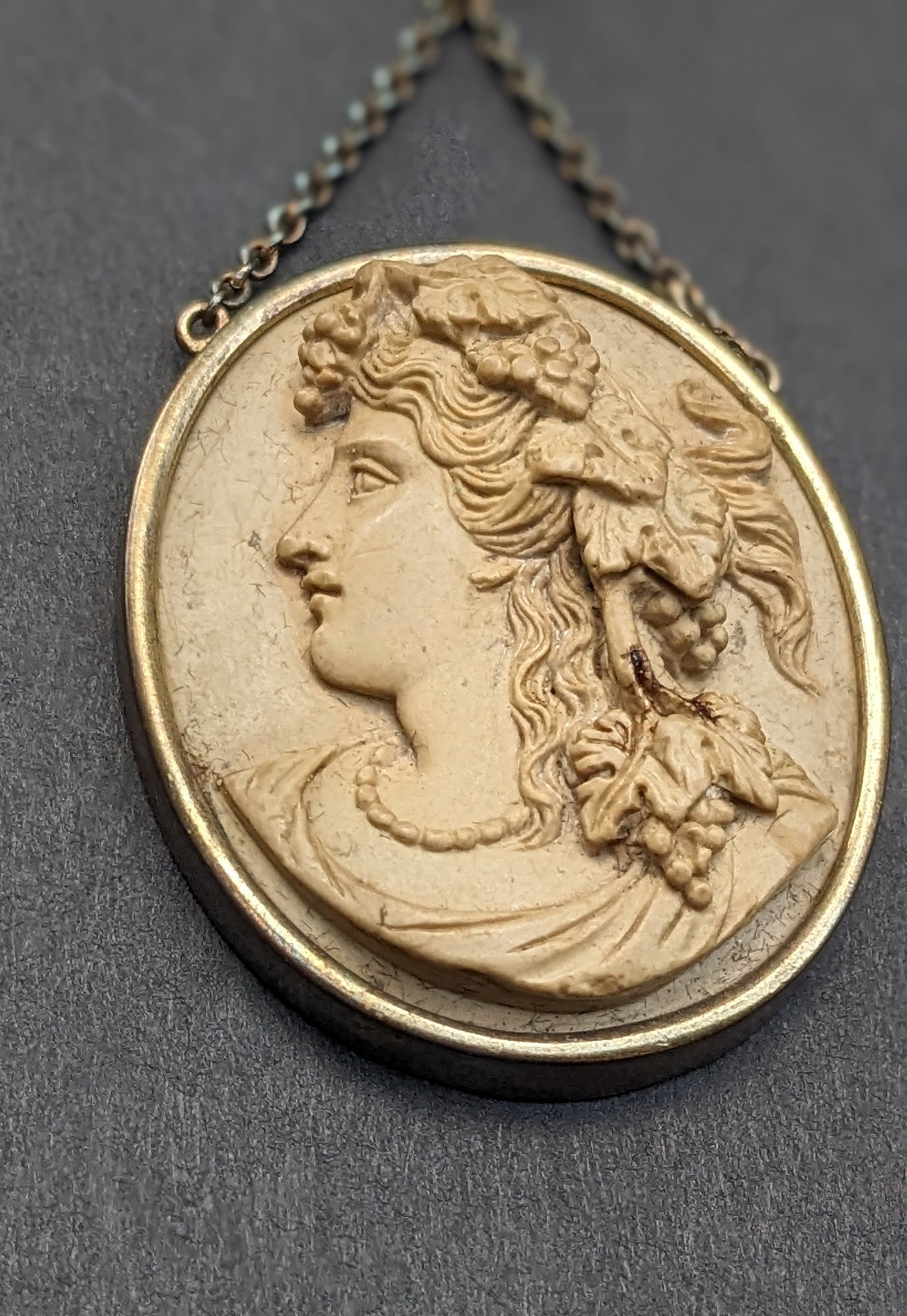 Carved lava cameo necklace. Barrel clasp