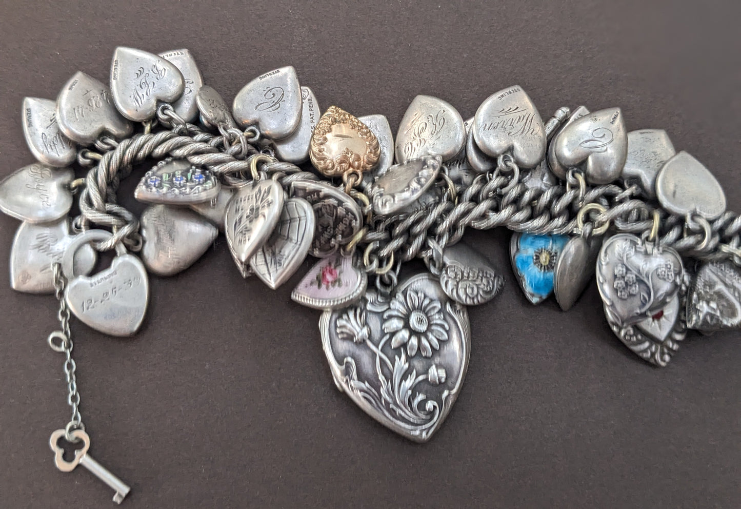 Amazing sterling puffy heart bracelet on patterned curb with heart & key clasp