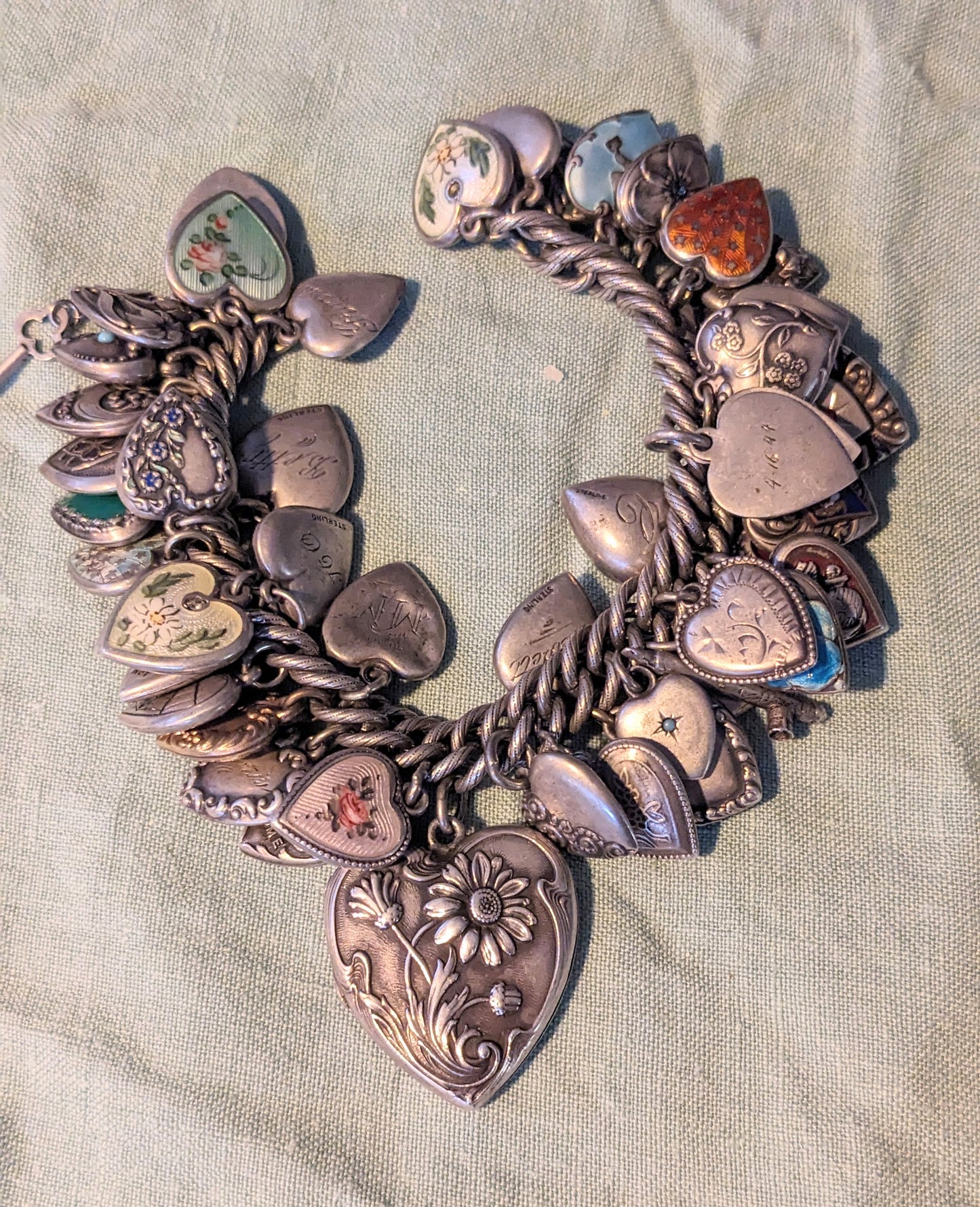 Amazing sterling puffy heart bracelet on patterned curb with heart & key clasp