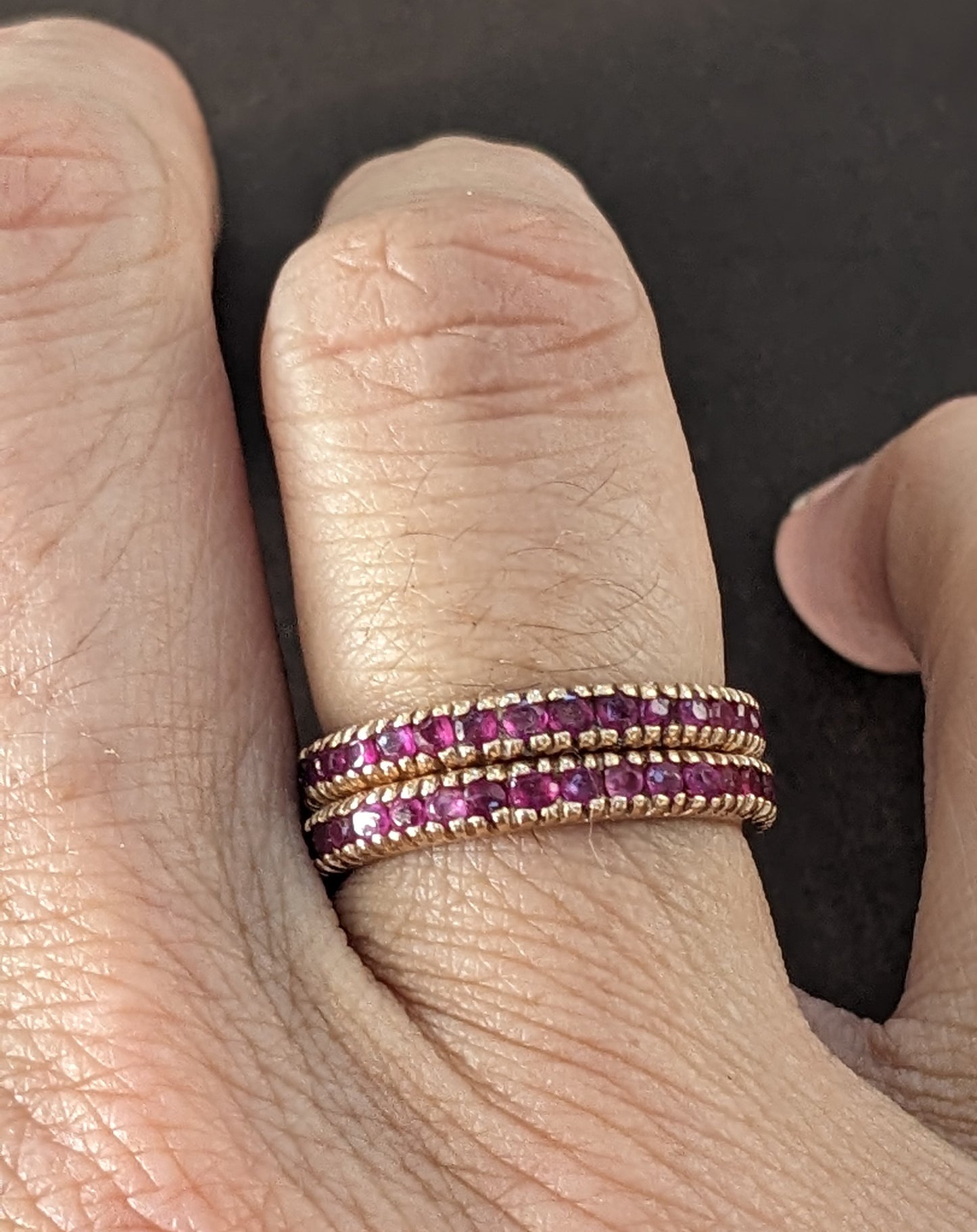 Pair of rose gold ruby eternity bands