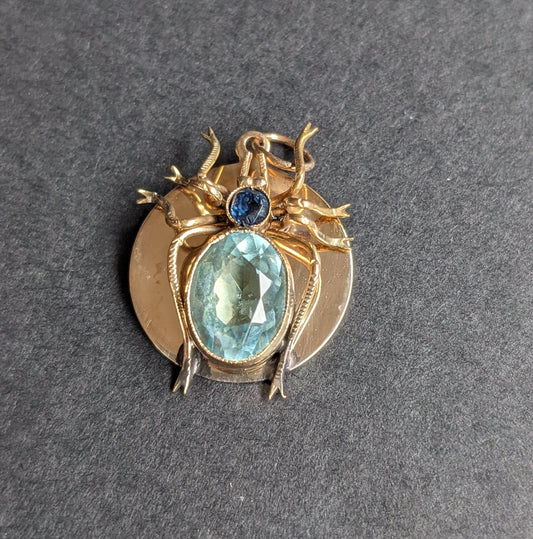 14k disk charm with spider