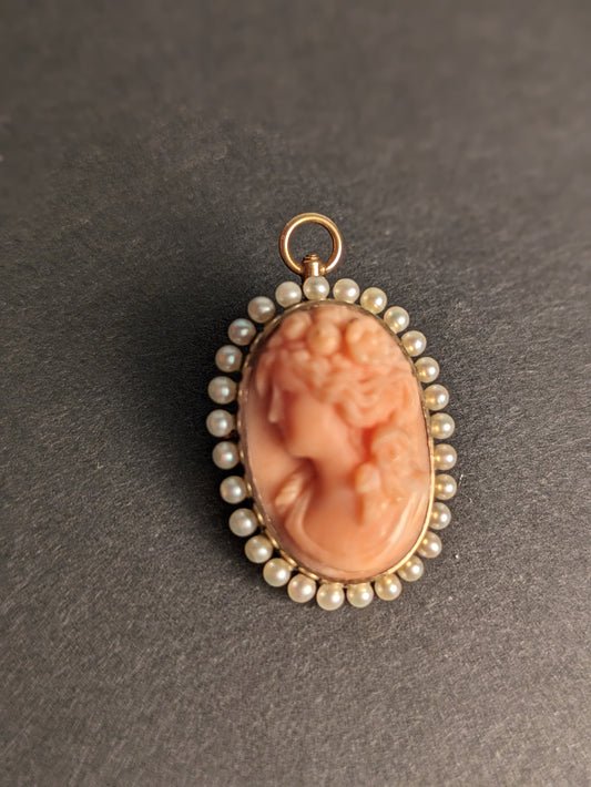 Carved coral cameo with pearl halo