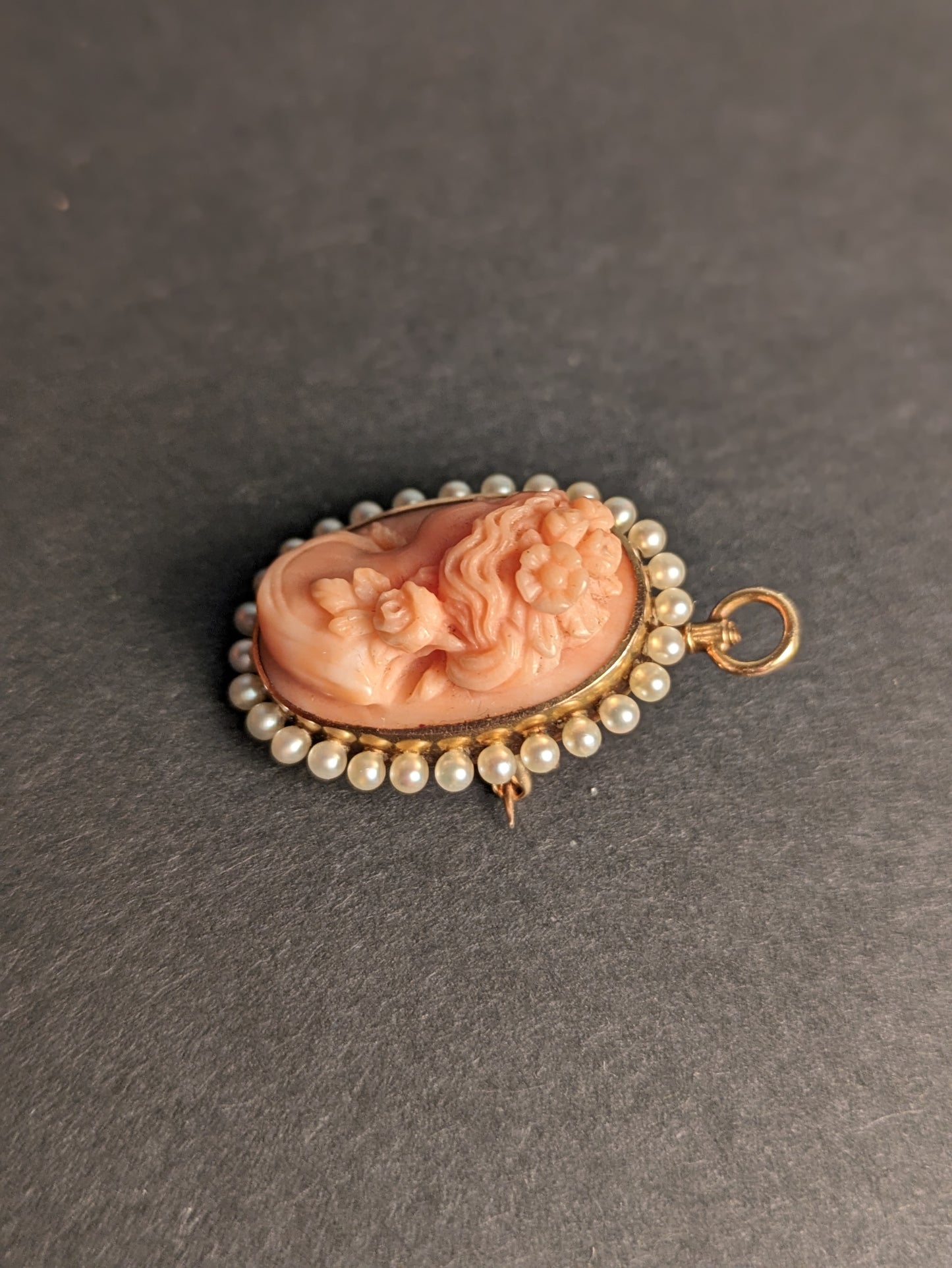 Carved coral cameo with pearl halo