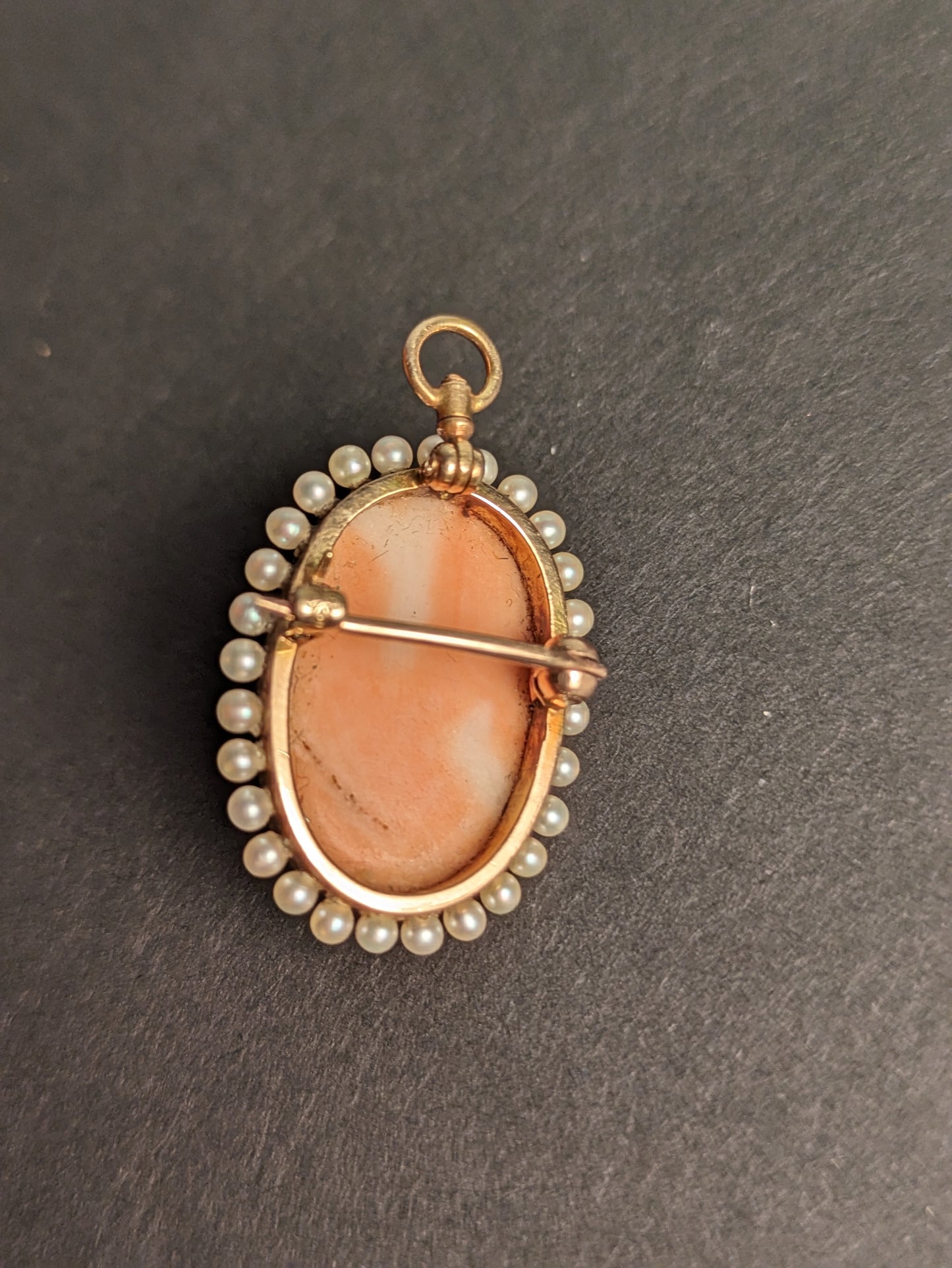 Carved coral cameo with pearl halo