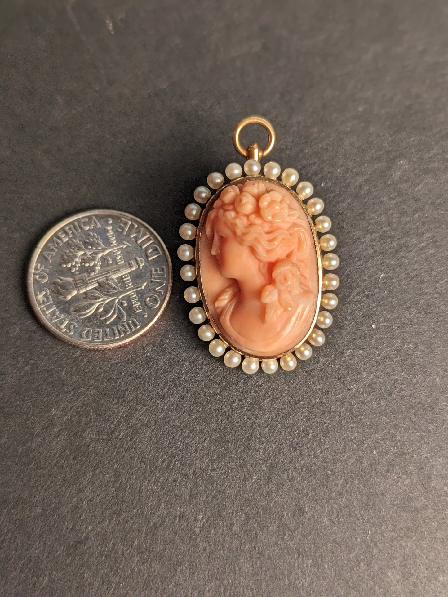 Carved coral cameo with pearl halo