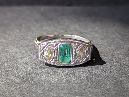 Edwardian filigree ring with emerald and diamond