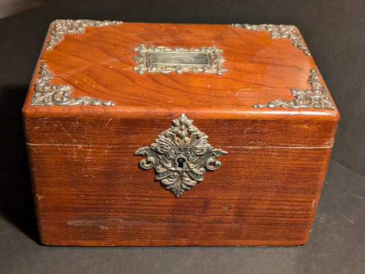 Wood jewelry box with silver decoration