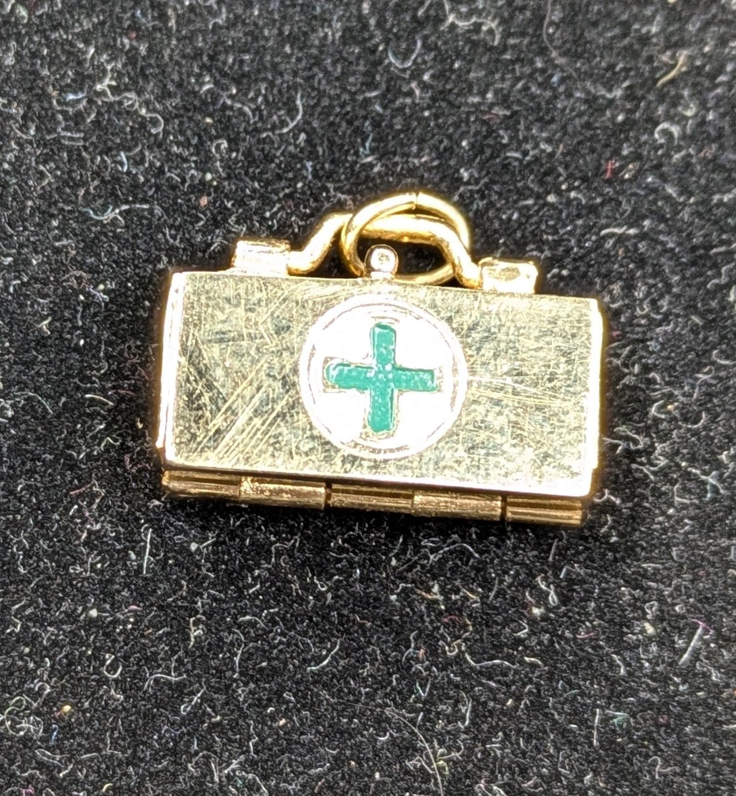 14kt Gold medical kit charm with additional internal charms