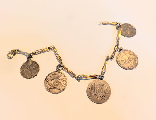 Gold bracelet with Sterling Love Tokens