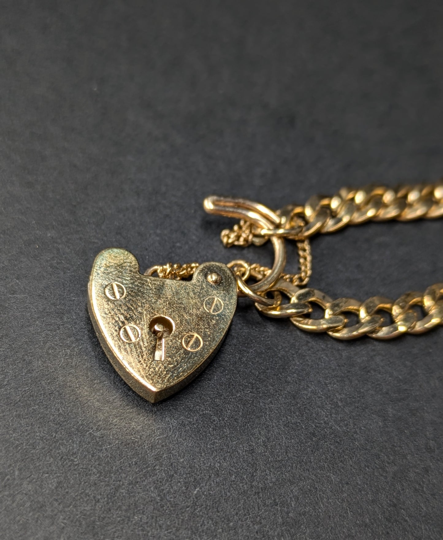 9k Flat Curb Bracelet with Heart Lock