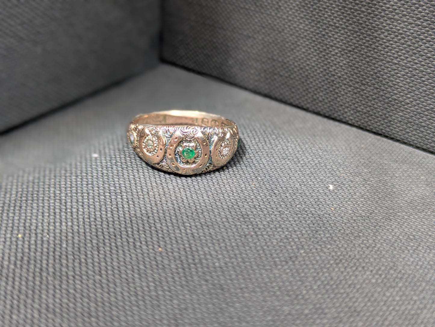 English 9k Horseshoe Repousse Ring with Emeralds