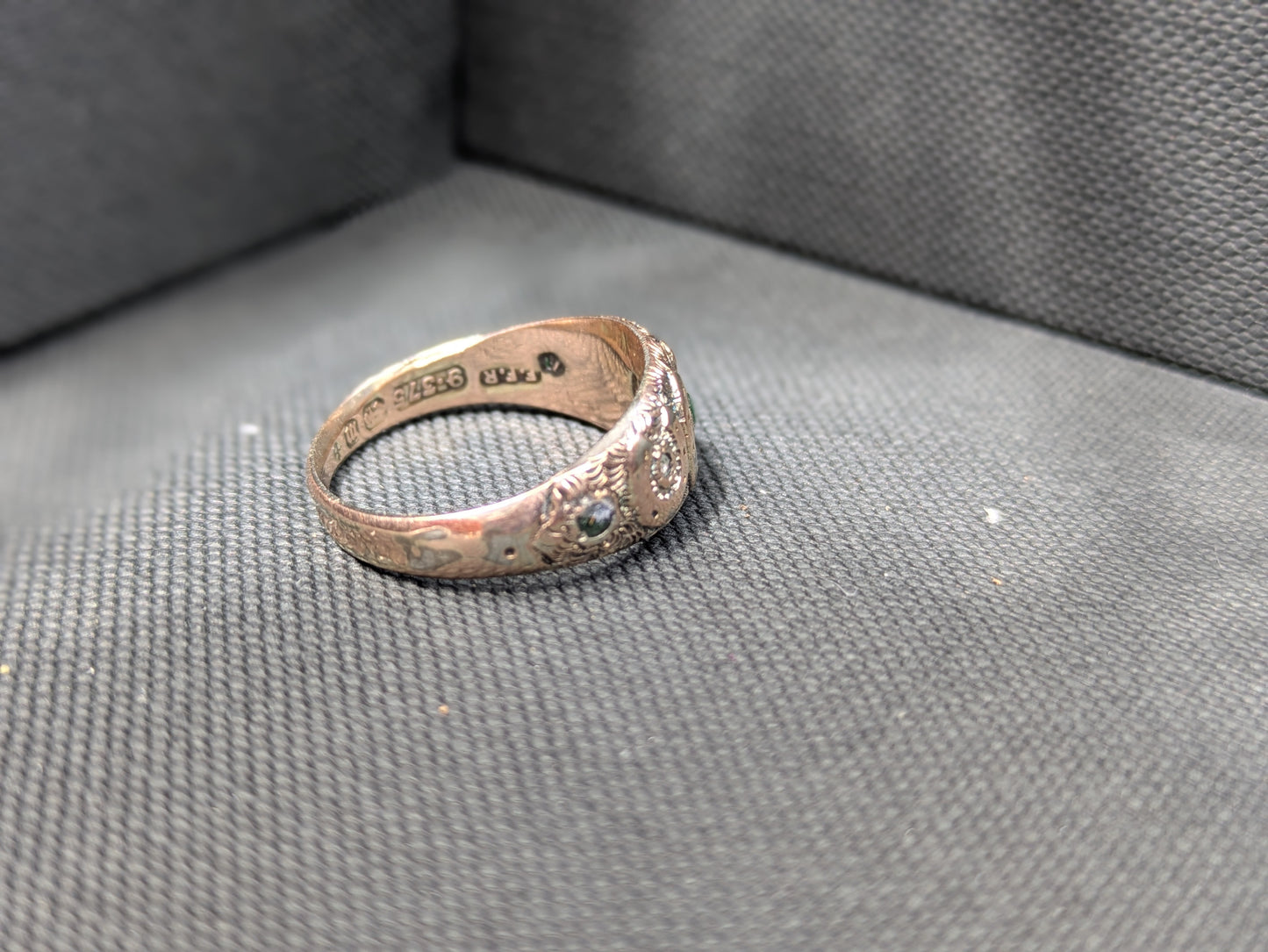 English 9k Horseshoe Repousse Ring with Emeralds