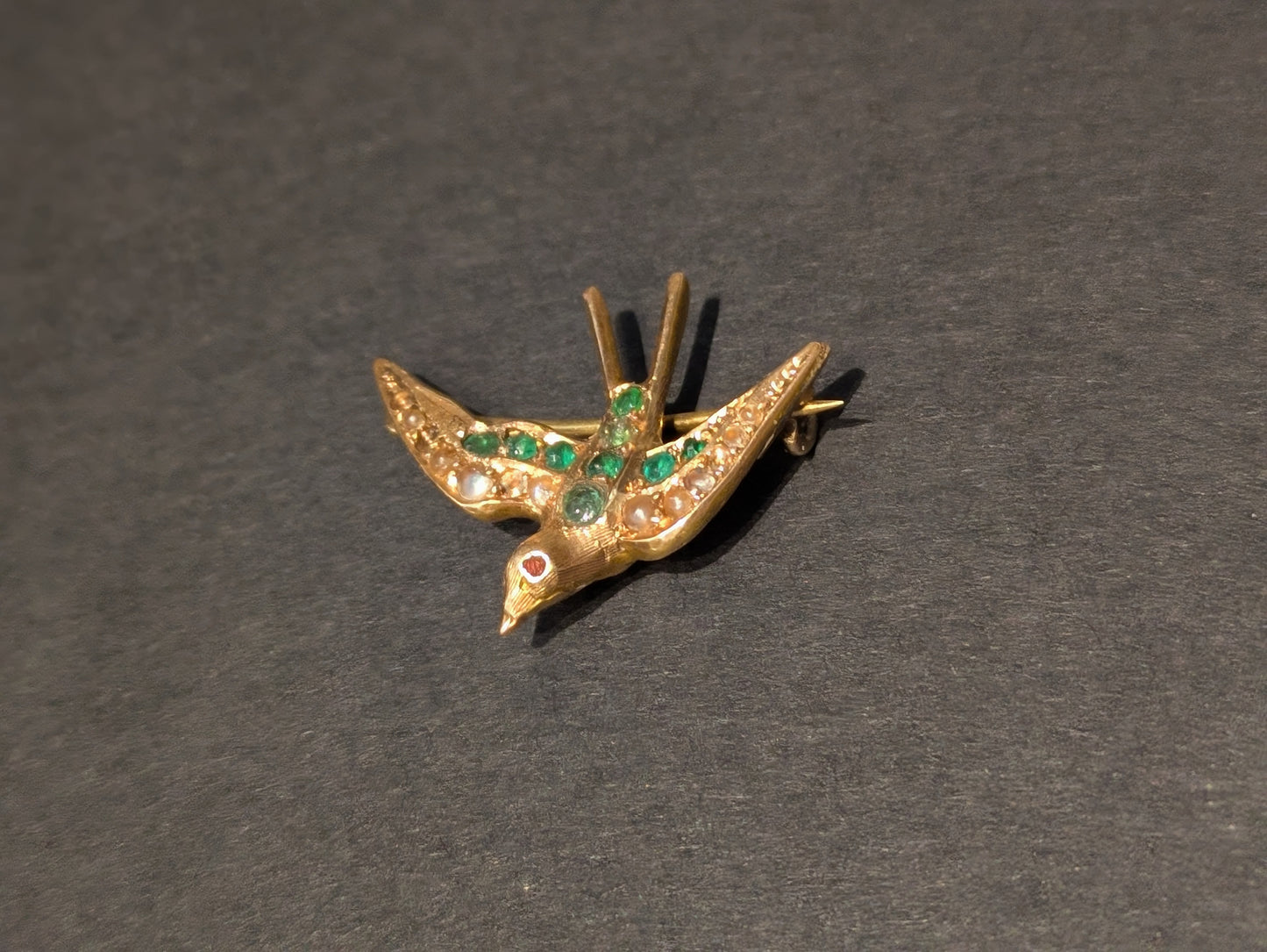 1915 14k Swallow Brooch set with Emerald and Seed Pearl