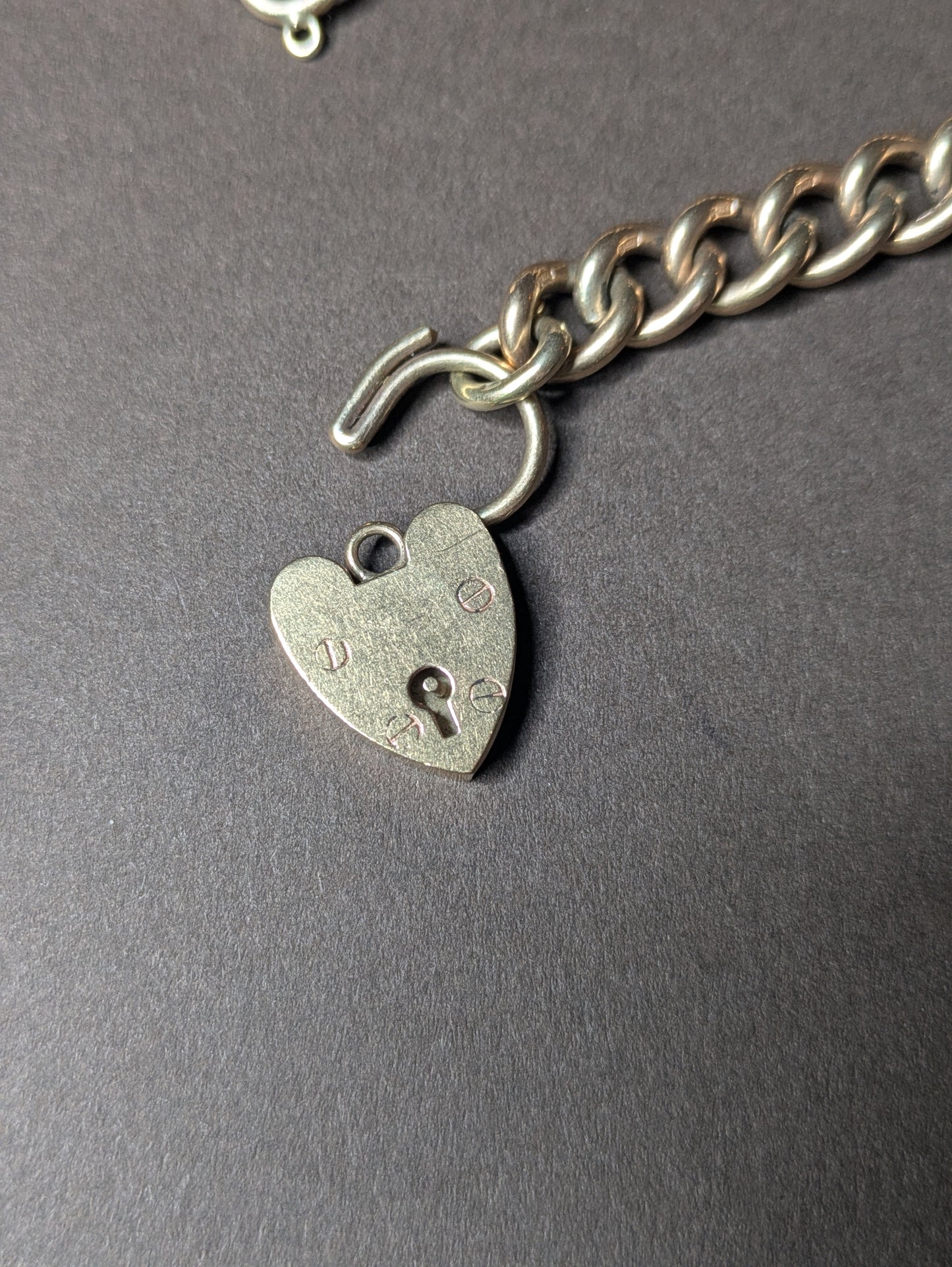 9k Solid Curb Chain Bracelet with Heart Lock Clasp Birmingham Hallmark