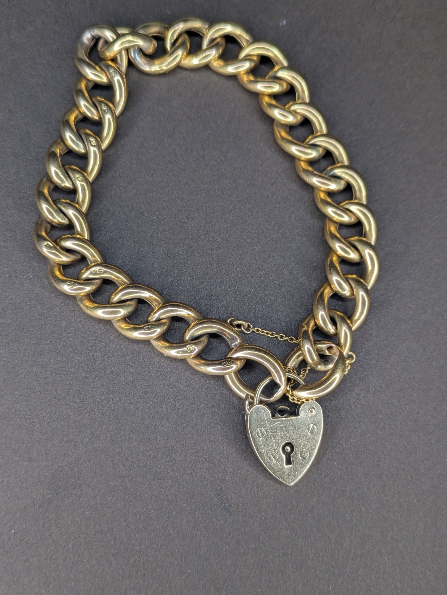 9k Yellow Gold Curb Chain Heart Lock Bracelet