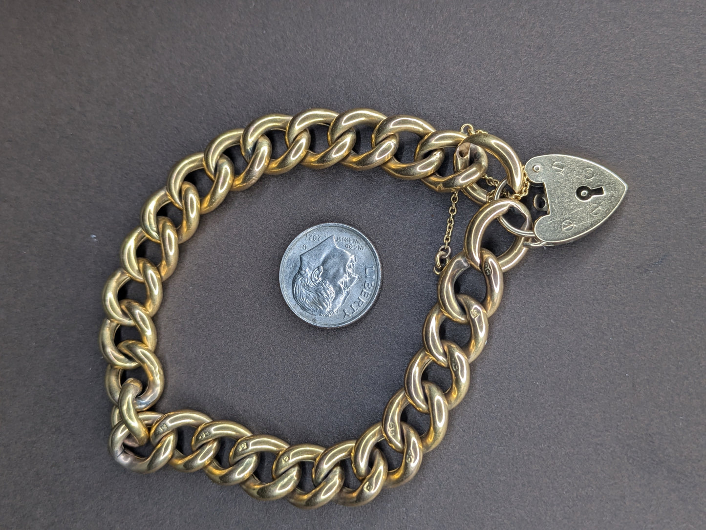 9k Yellow Gold Curb Chain Heart Lock Bracelet