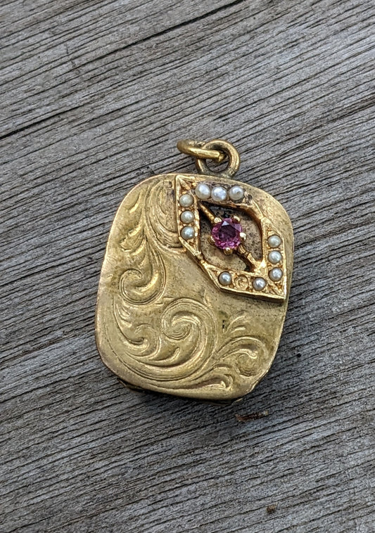 10K yellow gold locket with ruby and split pearl accents