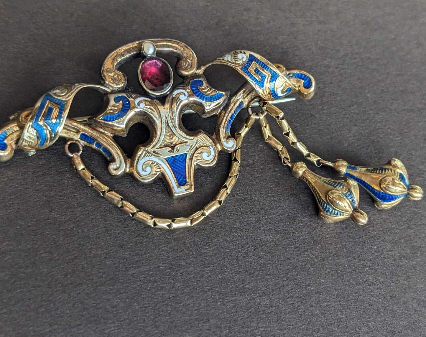 14k Gold, Blue and White Enamel Brooch with Foil Backed Garnet Stone