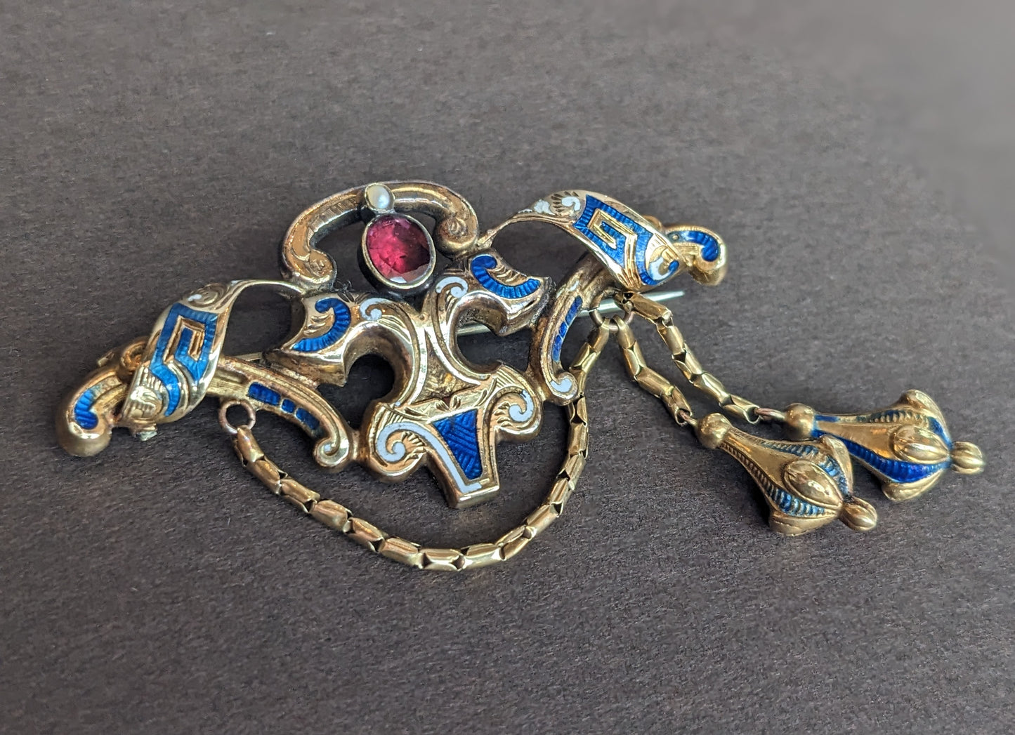 14k Gold, Blue and White Enamel Brooch with Foil Backed Garnet Stone